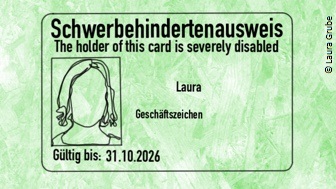 Eine grüne Karte auf der "Schwerbehindertenausßweis" steht. 